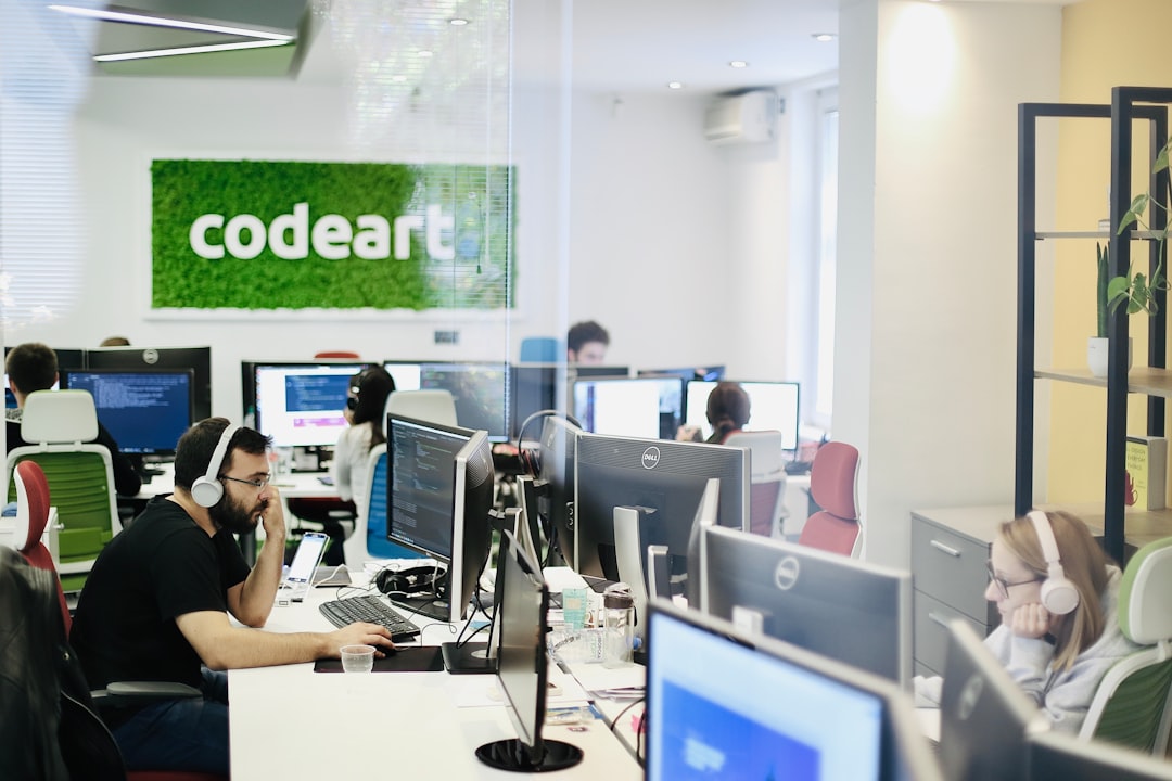 woman in black shirt sitting on chair using computer — IL WebDesign Manhattan