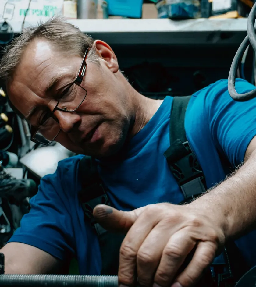 Experienced mechanic working on a vehicle in a repair shop