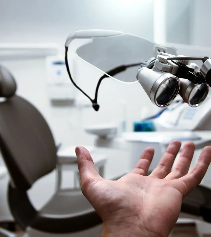 Modern dental operatory with chair and dental loupes