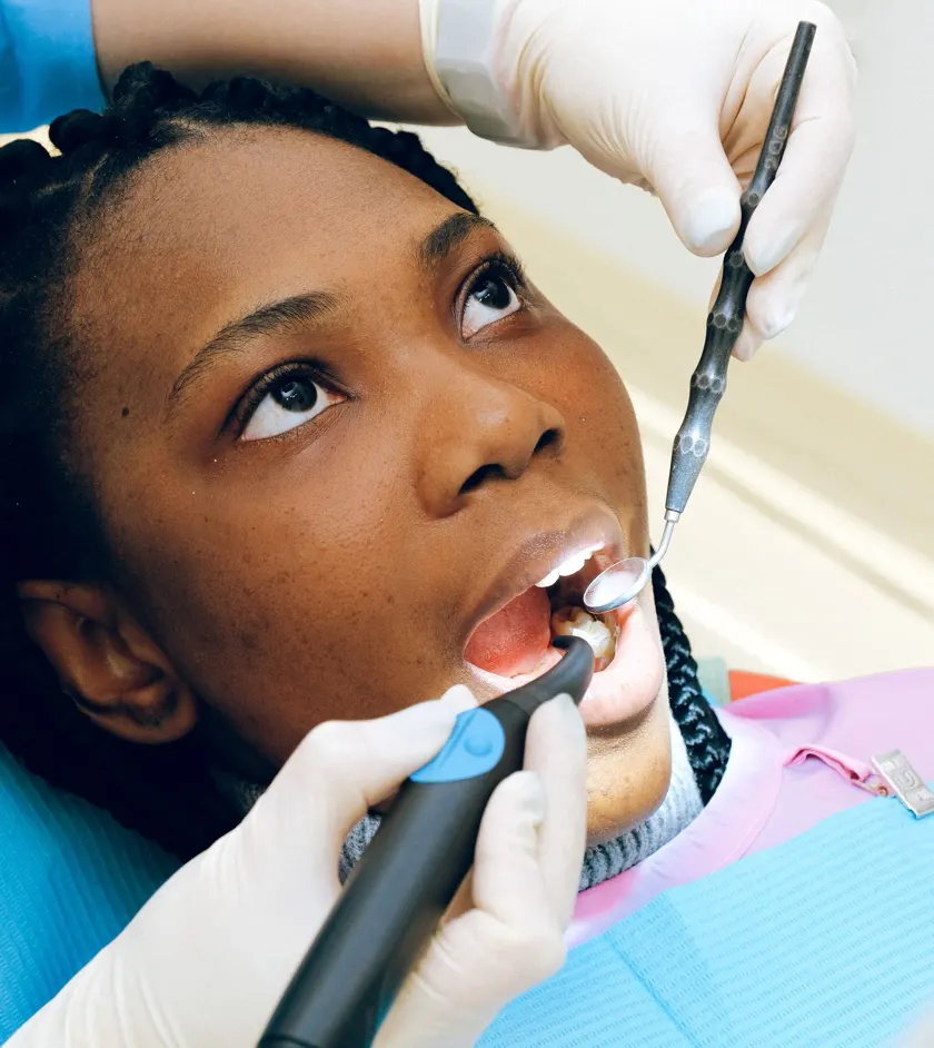 Dentist performing a dental procedure on a patient