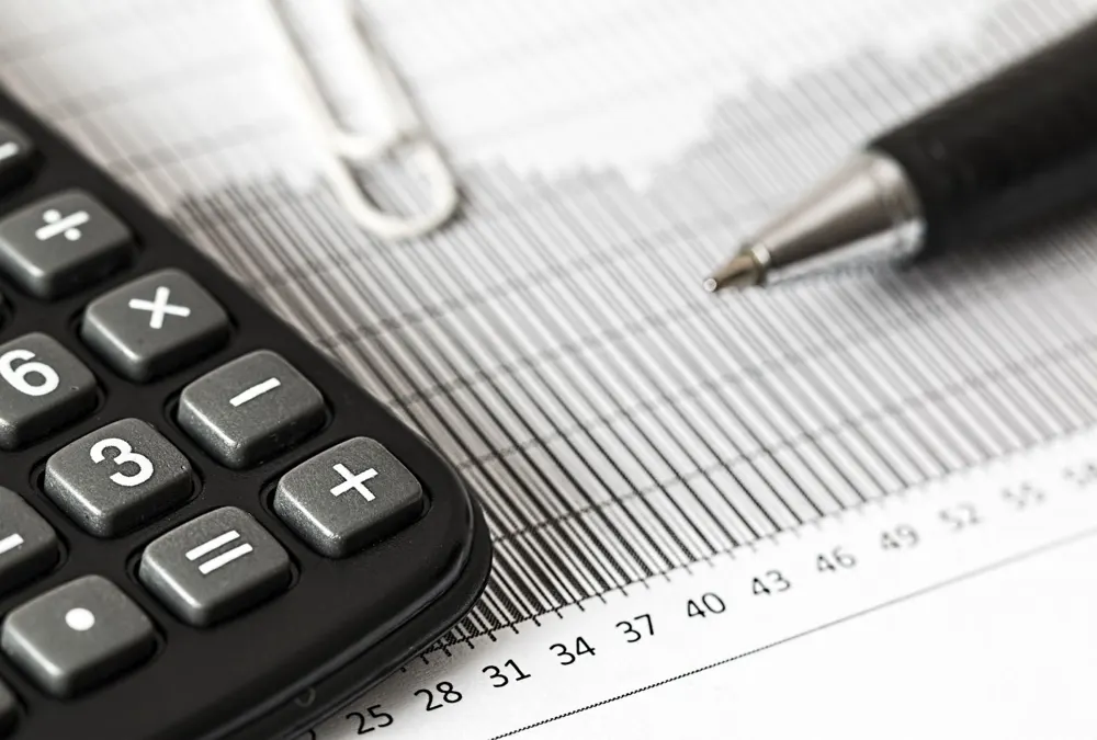 Financial advisor working at a laptop in an office