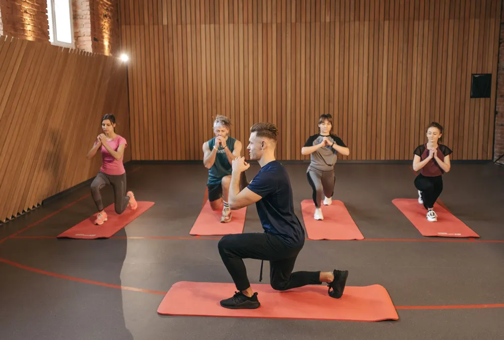 Instructor leading a group workout in a studio