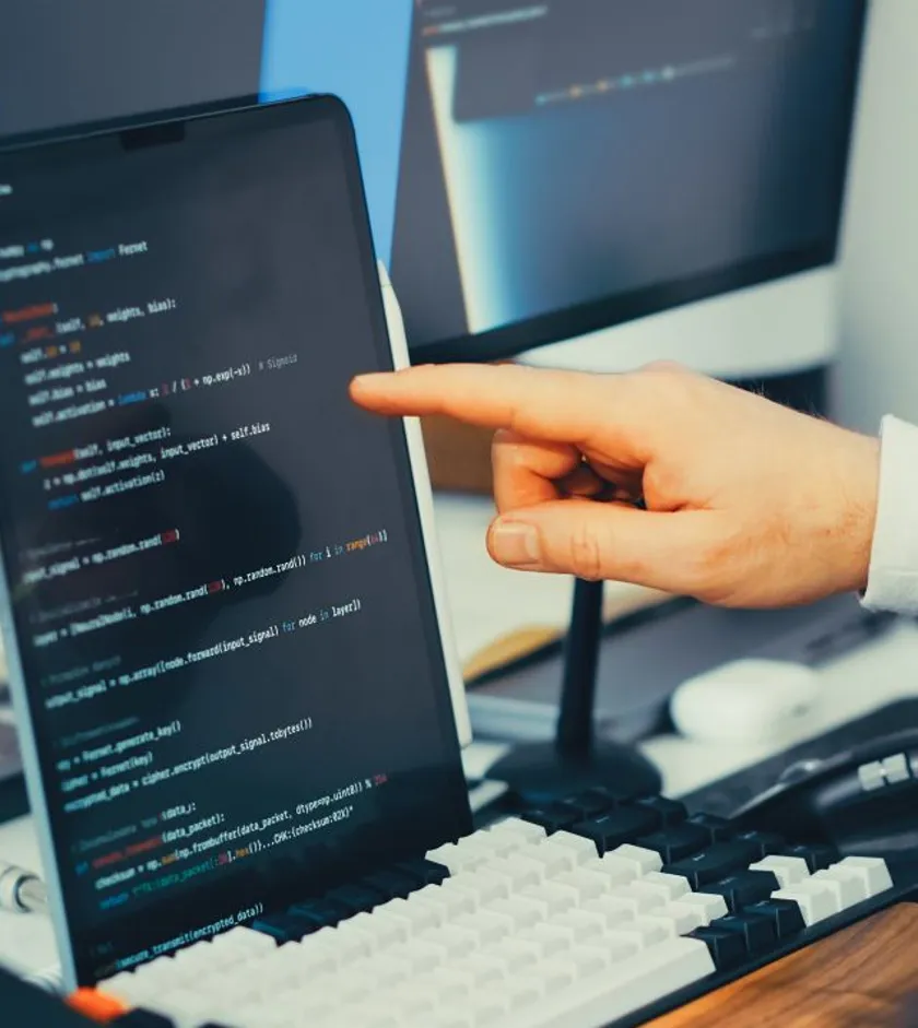 Developer reviewing website code for speed and security