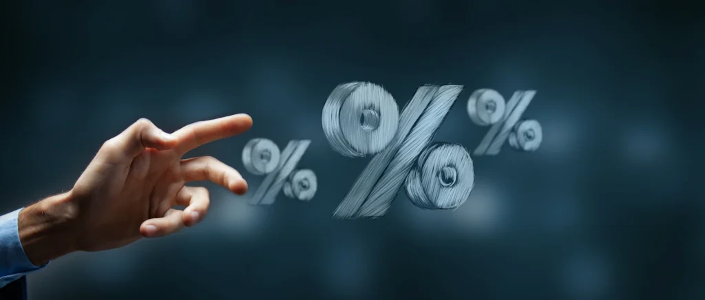 Hand reaching toward percentage symbols representing a lower cost per lead from optimized PPC
