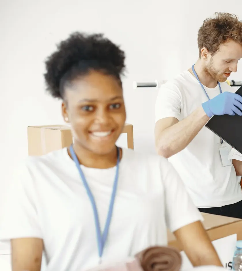 Smiling volunteer helping with donations