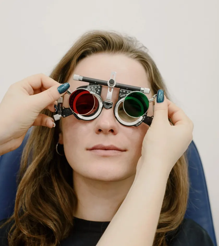 Patient having a vision test with a trial frame