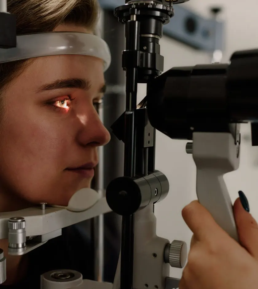 Close-up of an eye exam with a slit lamp