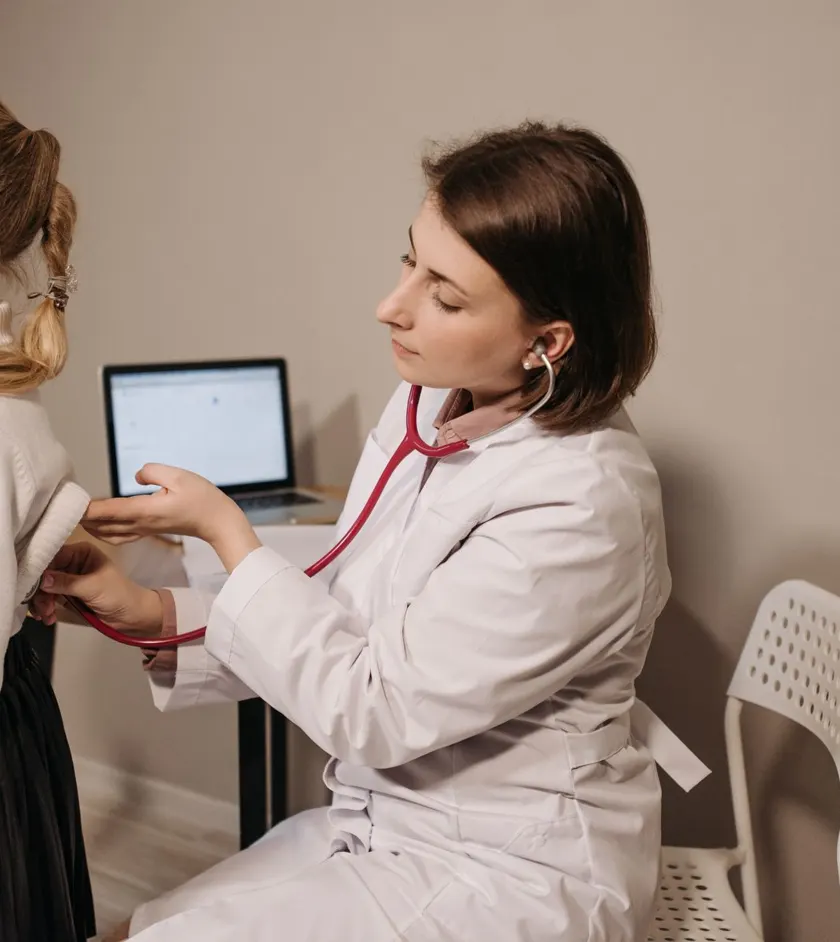 Doctor examining a child with a stethoscope