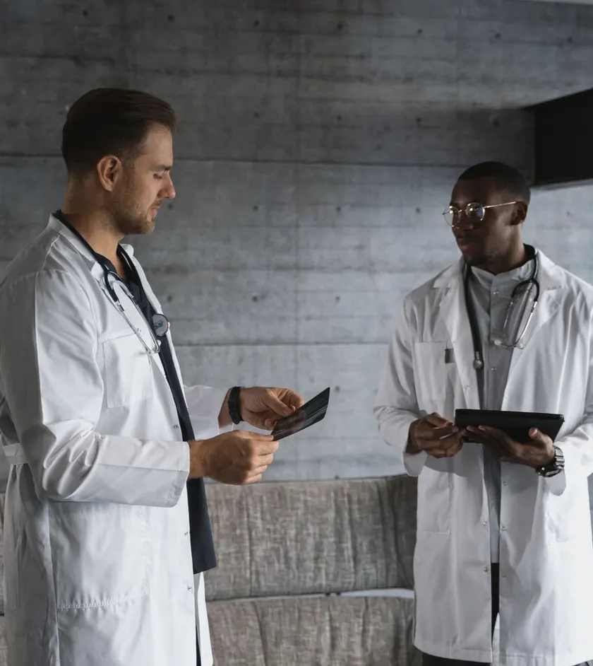 Doctors reviewing patient information on a tablet