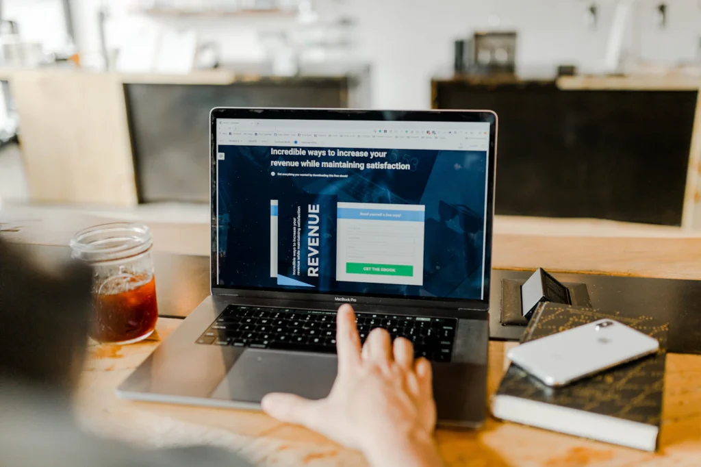 Laptop showing a high-converting PPC landing page with conversion tracking