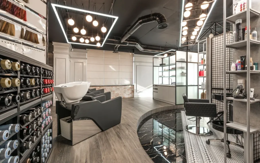 Modern hair salon interior with styling chairs and wash basins