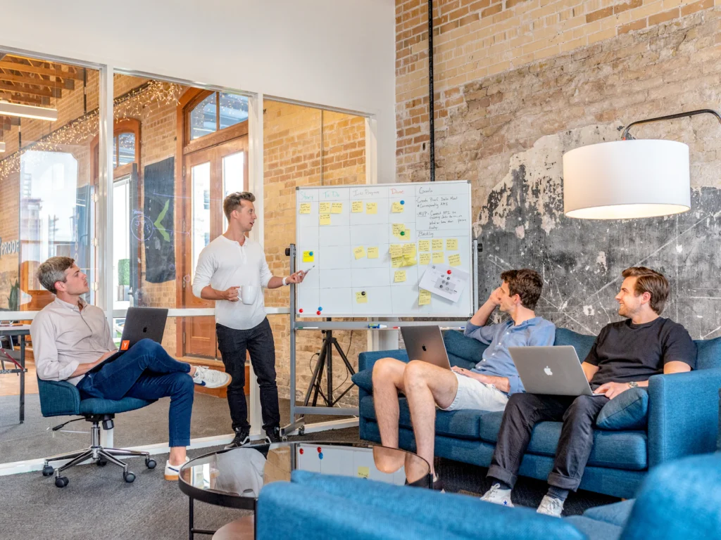 SEO team presenting a search engine optimization strategy on a whiteboard in a New York office