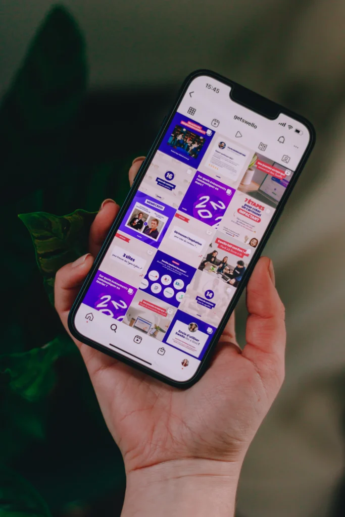 Branded Instagram feed with designed social media posts on a smartphone