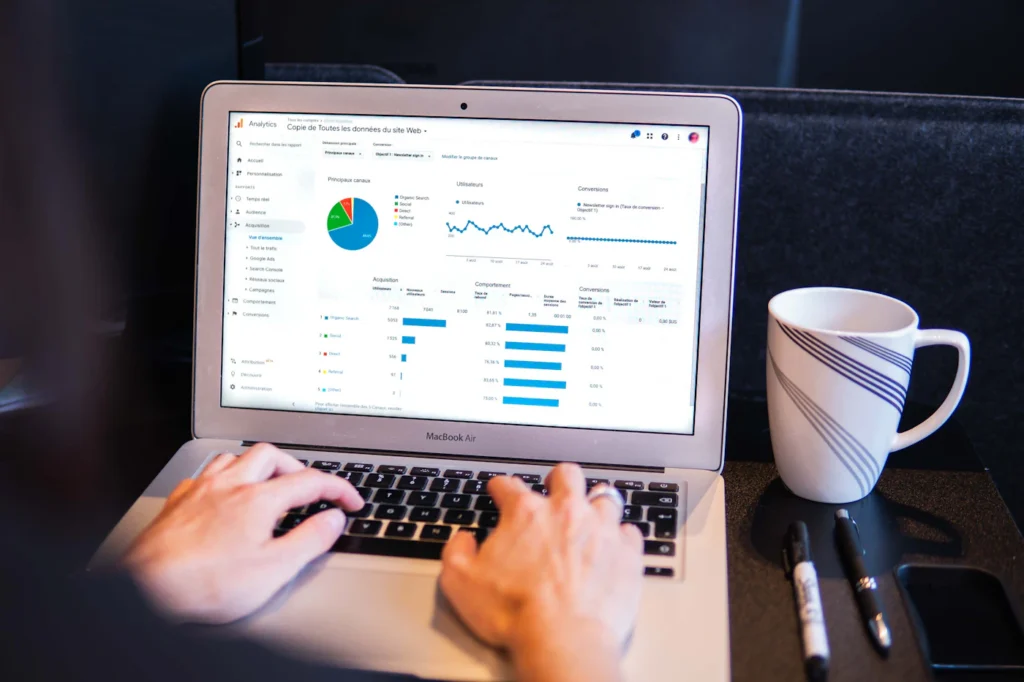 SEO specialist reviewing website analytics during a technical SEO audit on a laptop