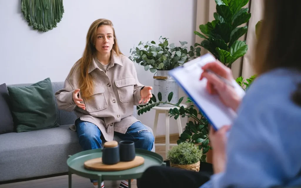 Client speaking with a therapist in a calm office