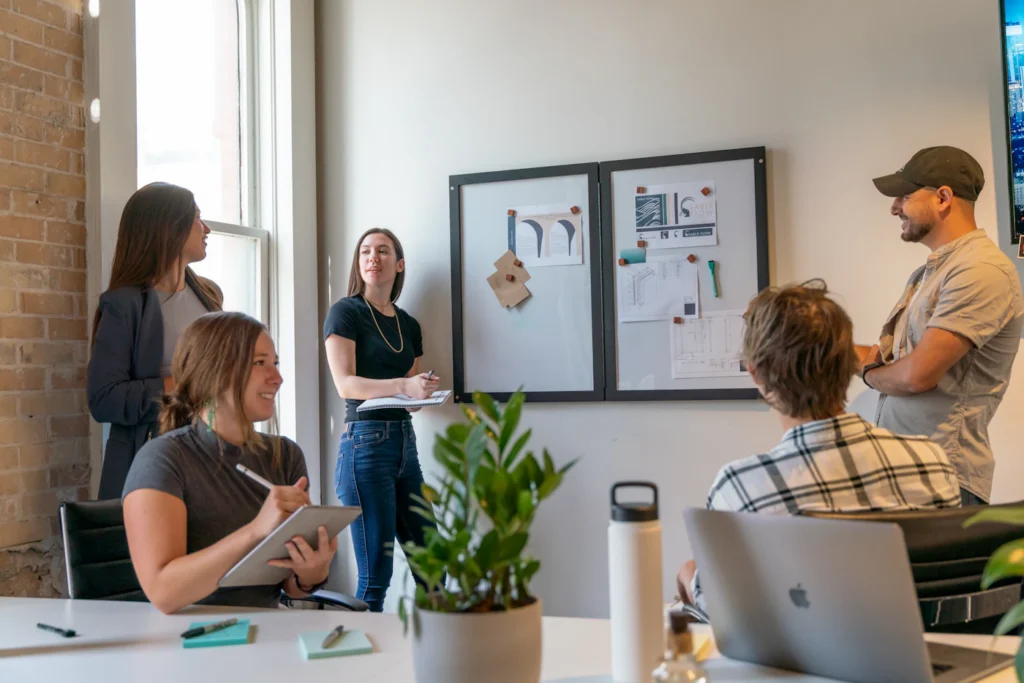 Website strategy meeting with a client reviewing goals, sitemap, and brand direction